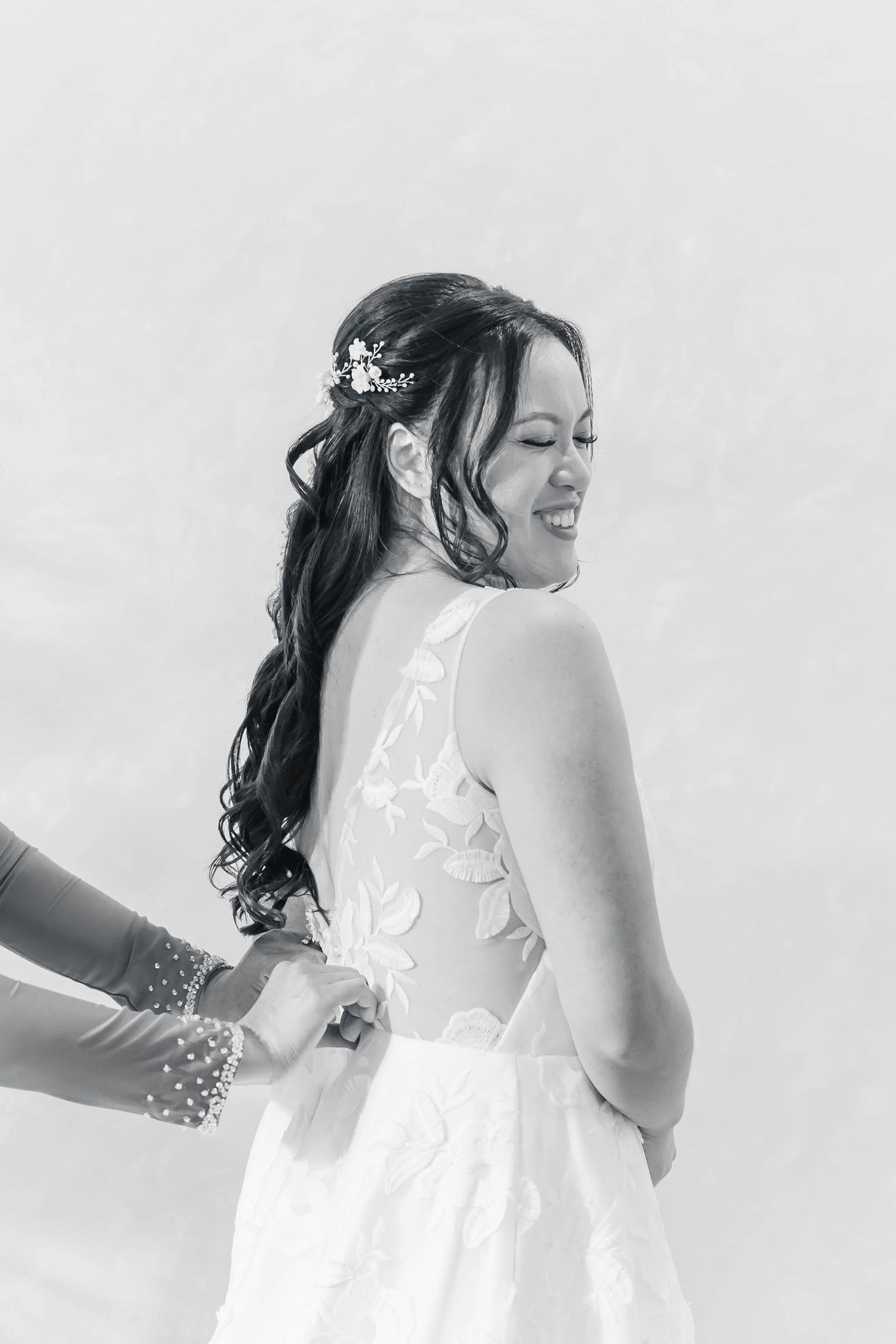 Black and white artistic bridal portrait series showing details of a white lace wedding dress.