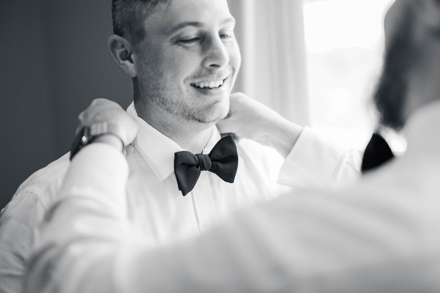 Close-up portrait in formal wear showing soft contemplative expressions.