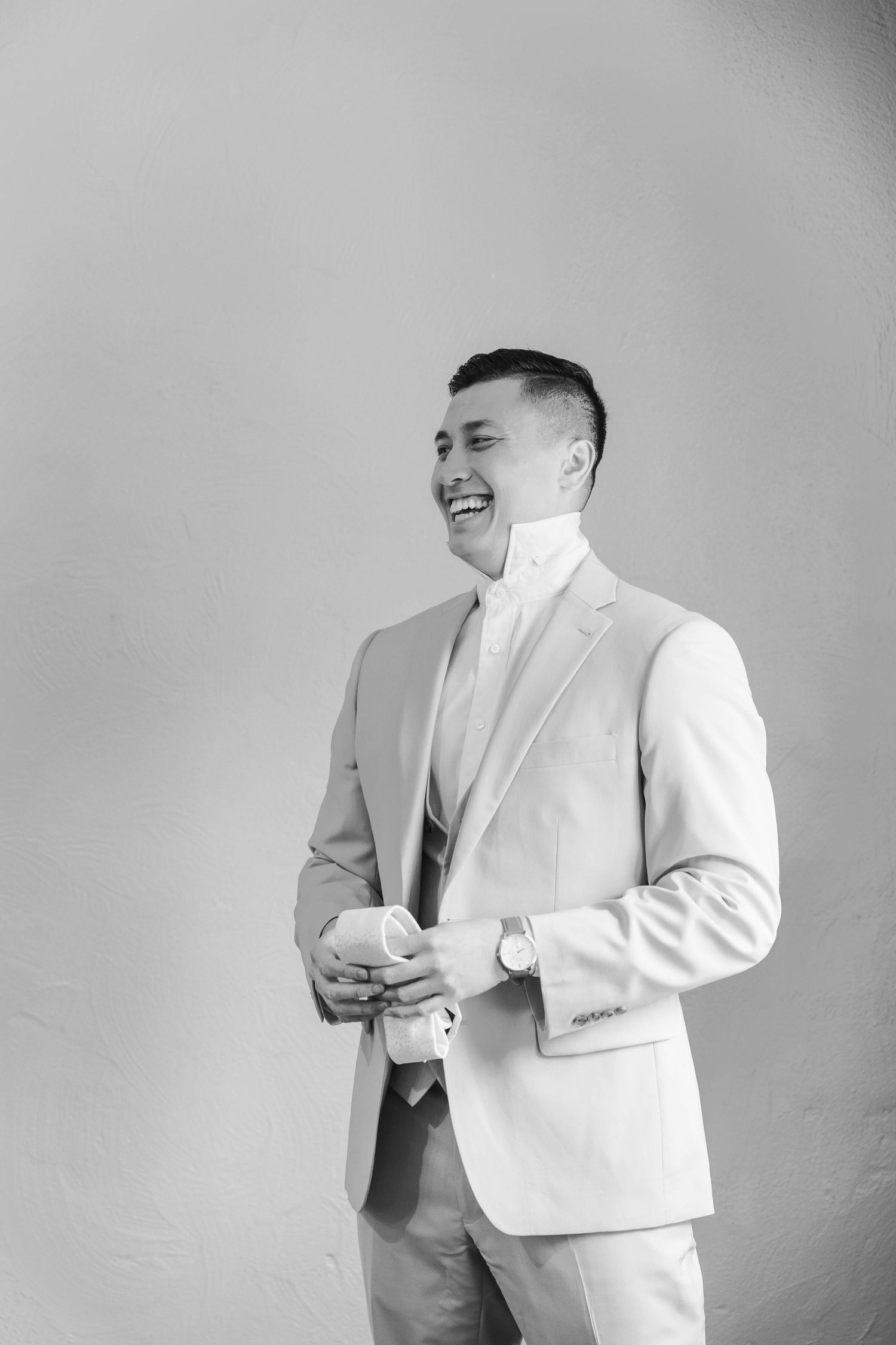 Side profile shots of someone in a white suit jacket making different poses.