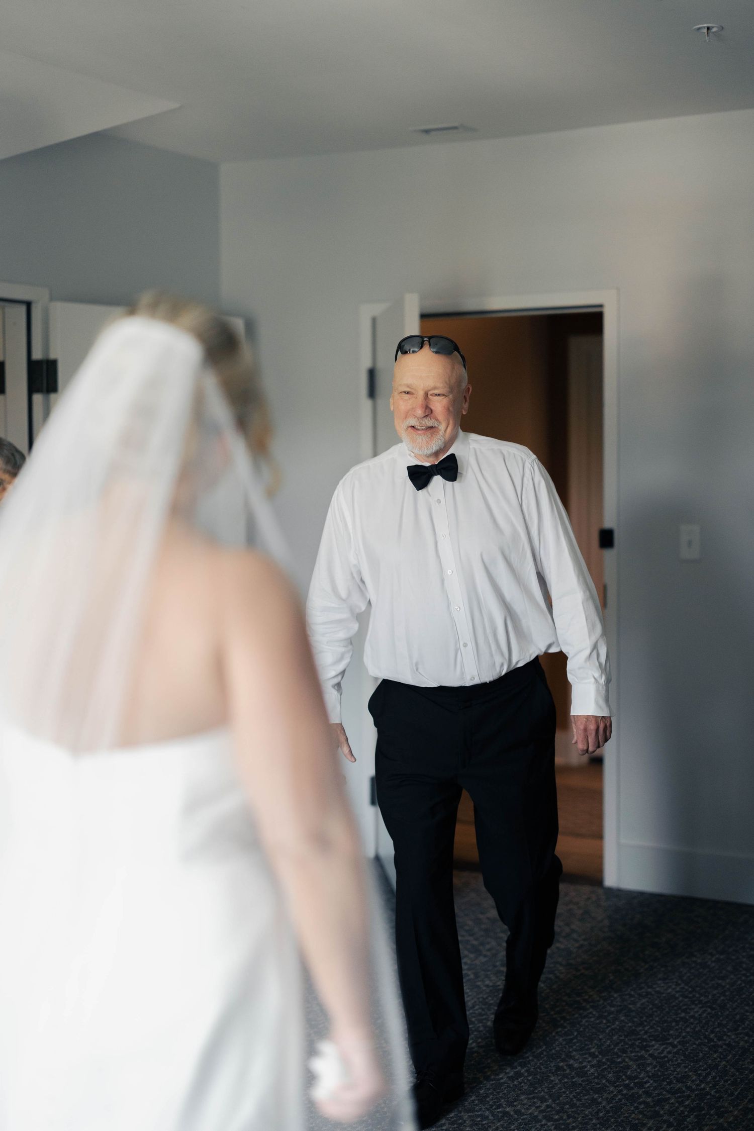 First look moment captured in a bright indoor setting.