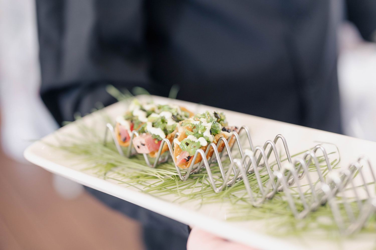 Elegant appetizers arranged in small glass dishes on display.