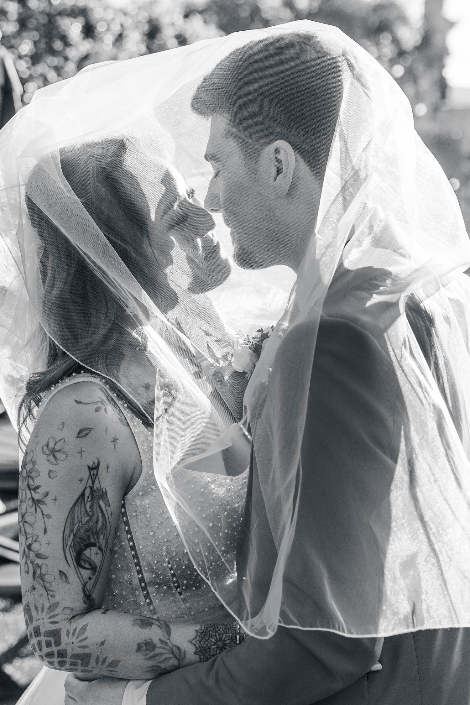 A series of black and white wedding portraits showing an intimate moment between newlyweds.