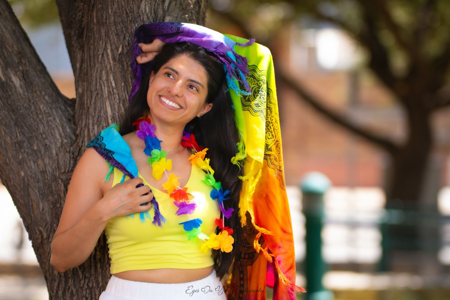 Vibrant carnival-style dance photos with colorful feathers and costumes.
