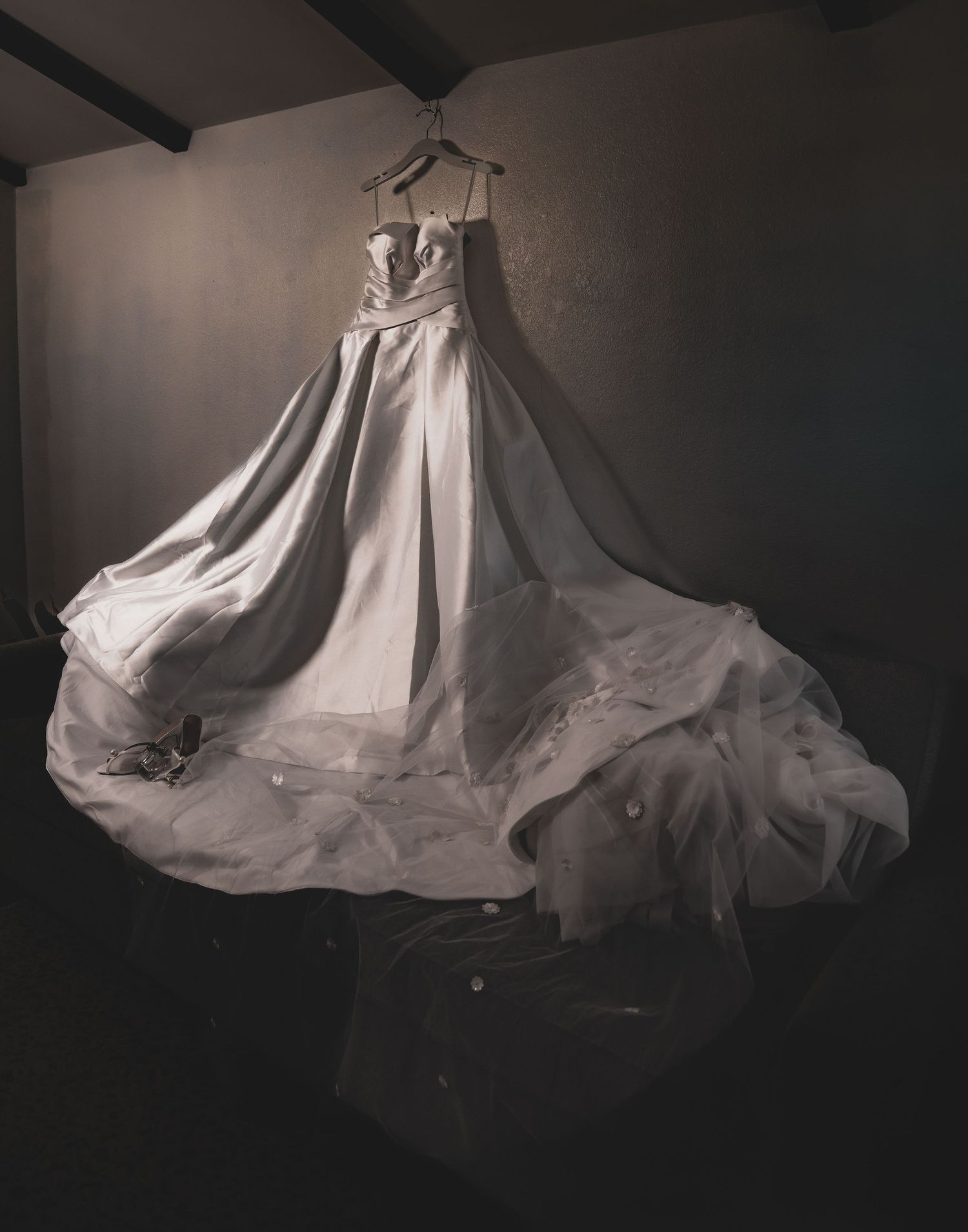 A flowing white wedding dress suspended in mid-air creates a ghostly silhouette against a dark background in multiple views.