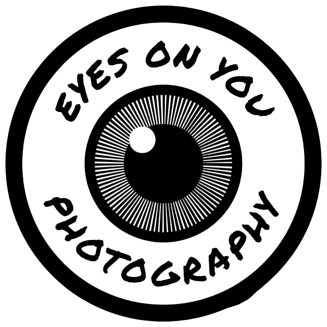 A black and white repeating pattern of stylized eye illustrations arranged in a horizontal sequence.