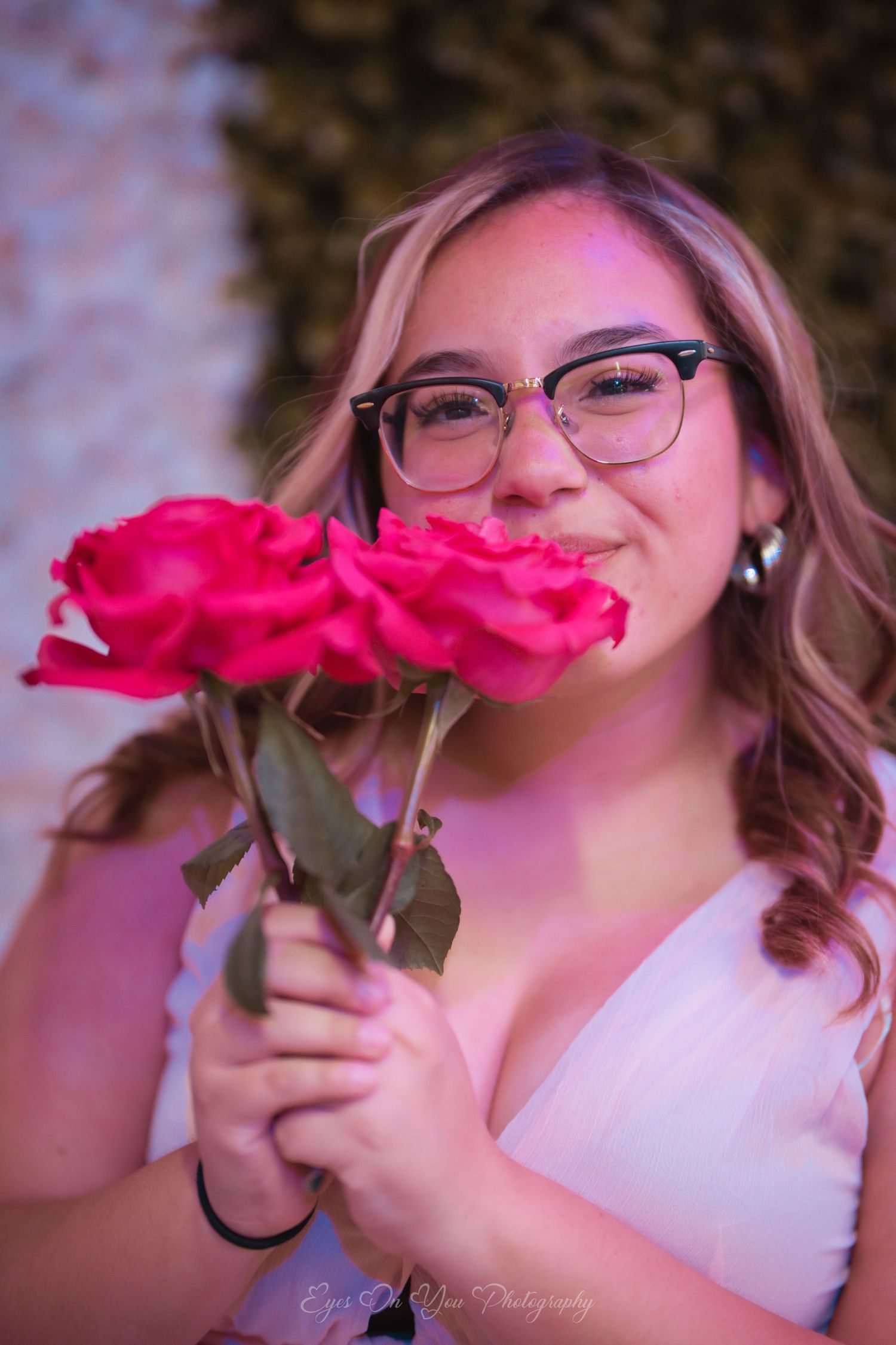 Playful photo sequence showing pink roses held in front of lips in a whimsical pose against a light background.