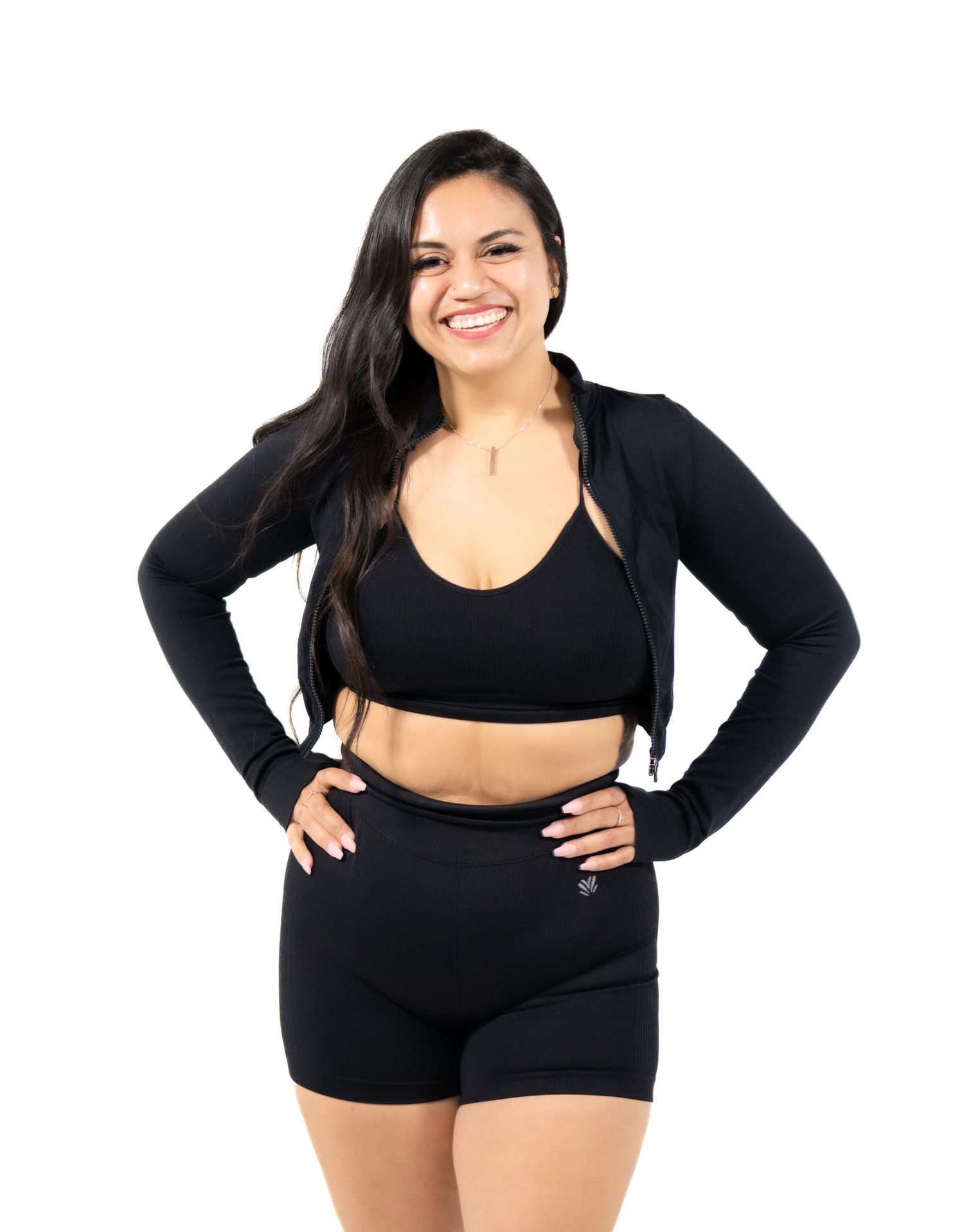 Woman in black athletic wear strikes confident poses showing fitness and body positivity.