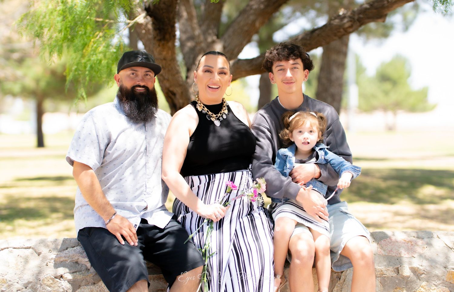 Family members spending time together outdoors in a natural setting.
