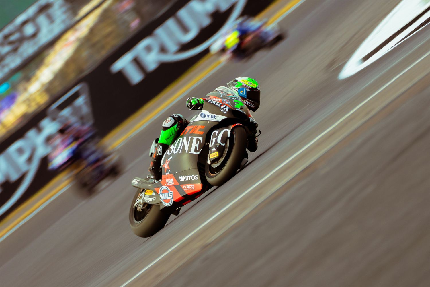 Barry Baltus leans through a corner at dramatic angles during a Moto2 Race at Silverstone .