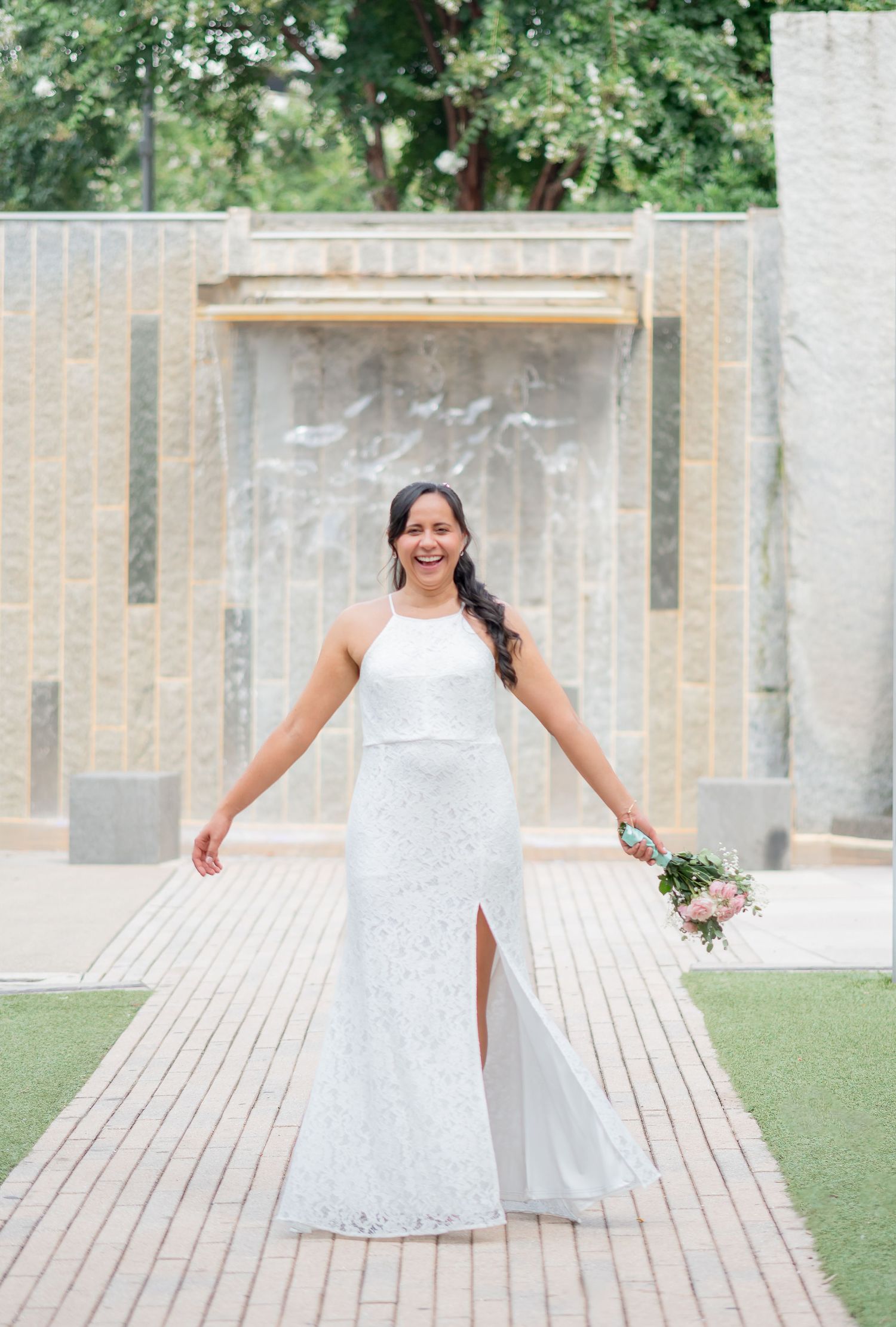 Beautiful couple after their elopement wedding in Charlotte NC. Bride wearing simple white dress while groom wears gorgeous blue suit.