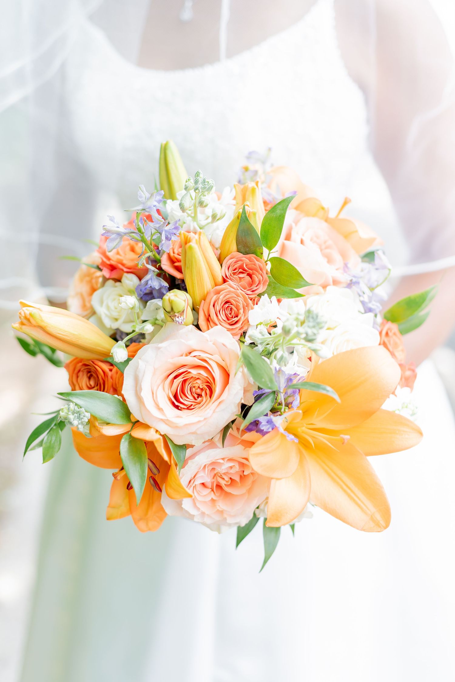 Details of a brides dress and beautiful flowers before her elopement wedding ceremony.