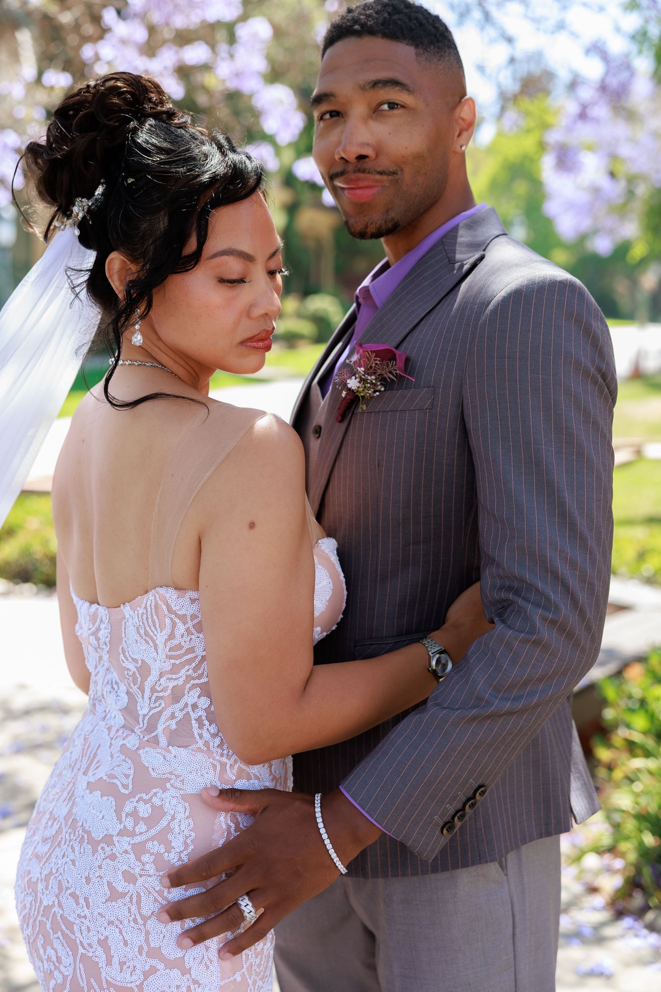 Bride and groom exiting wedding under sparklers at Balboa Park