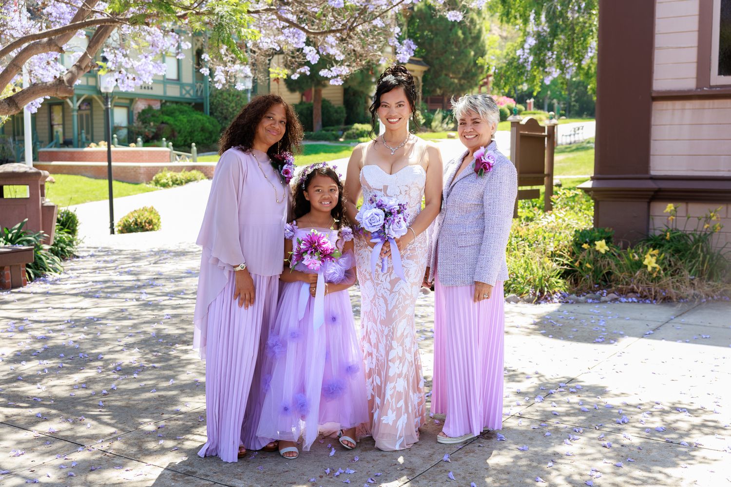 Bride and groom posing with family during Balboa Park wedding