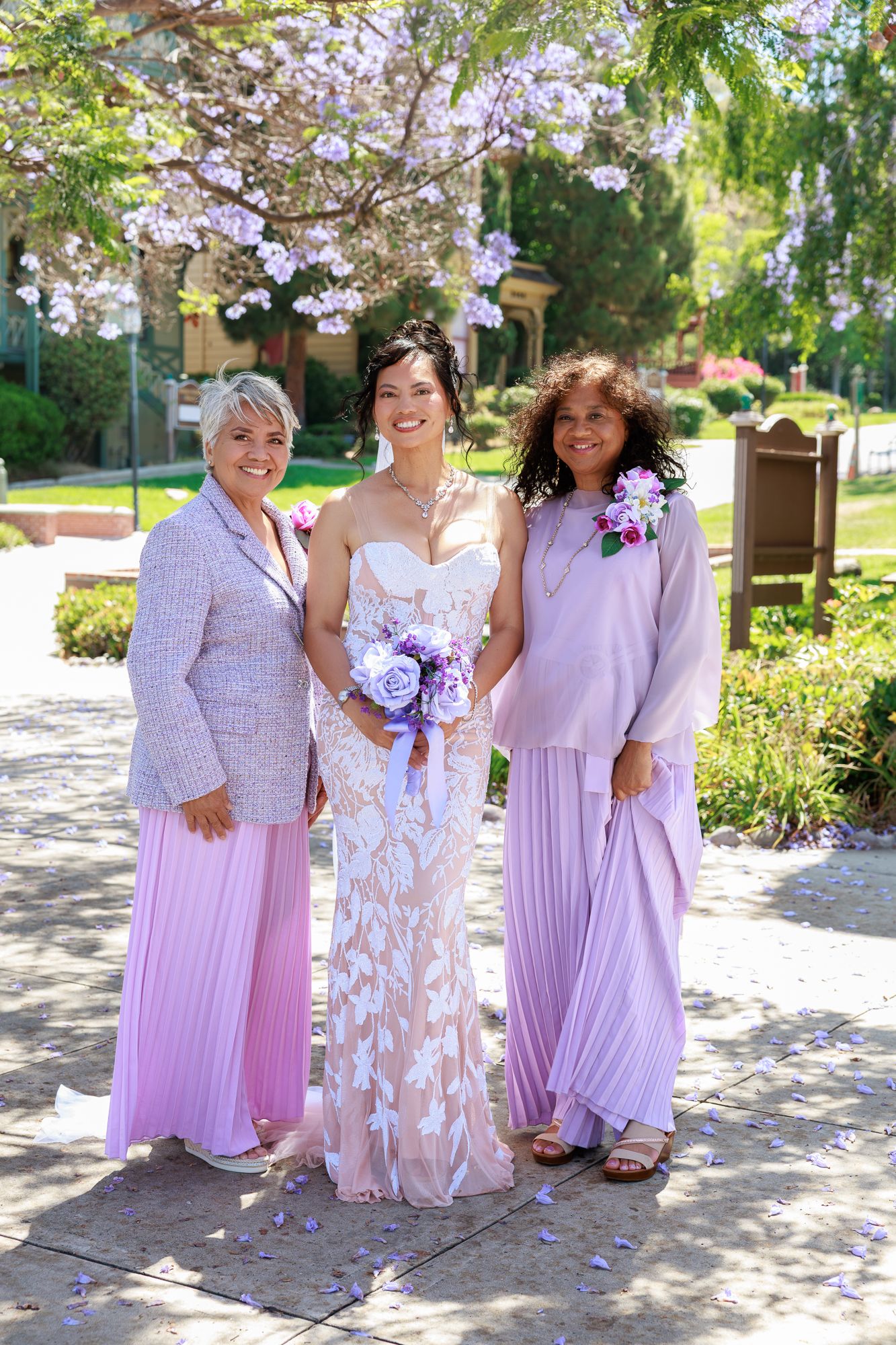 Bride and groom posing with family during Balboa Park wedding in San Diego