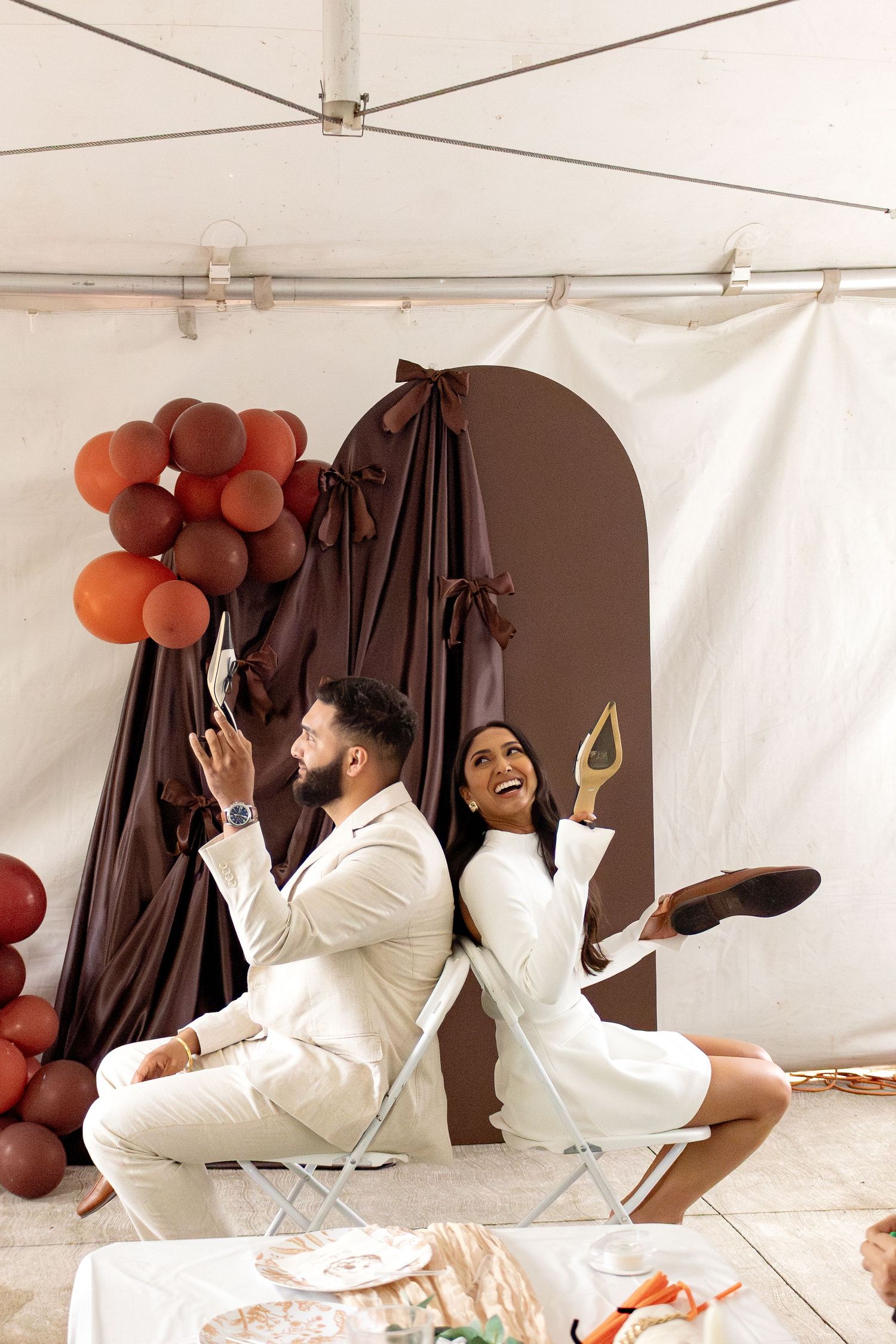 This image shows a couple playing the who is more likely to game at their bridal shower.