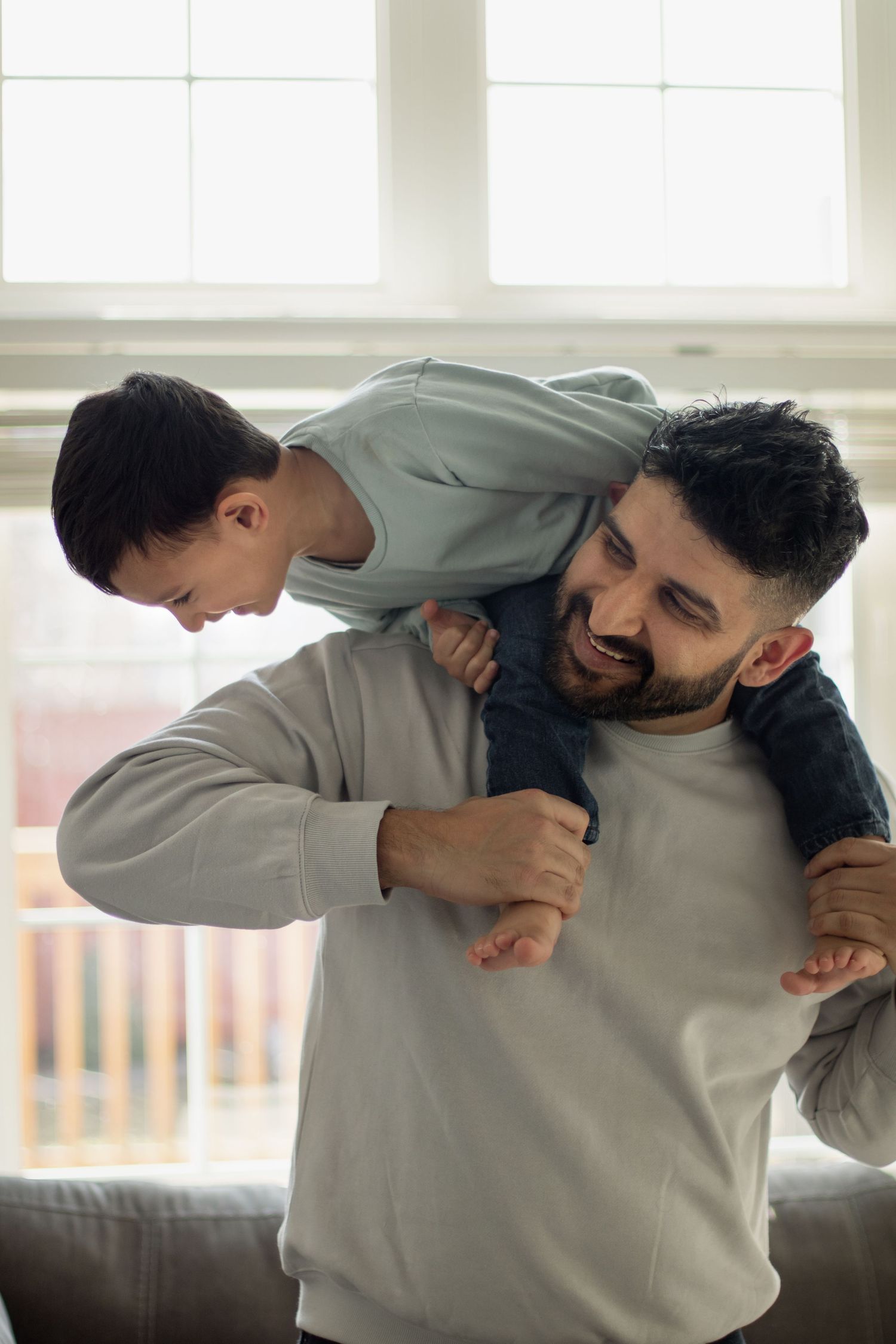 This image shows a dad playing with his son.