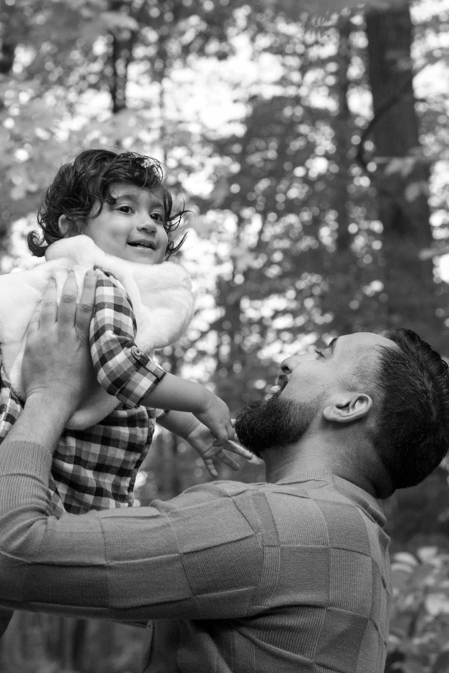 A father and daughter playful moment in the park