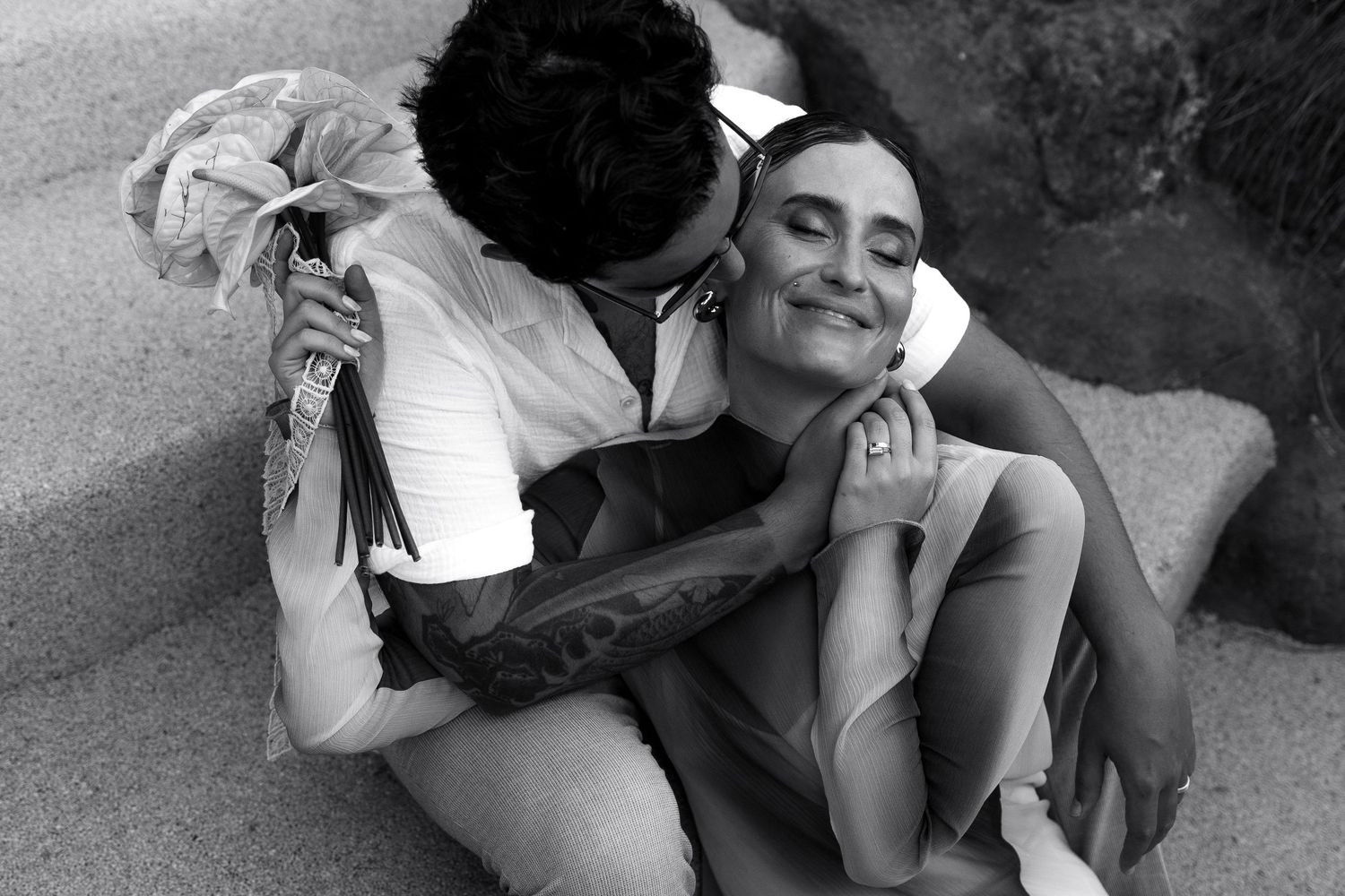 Candid black and white photos capturing playful moments on the ground.