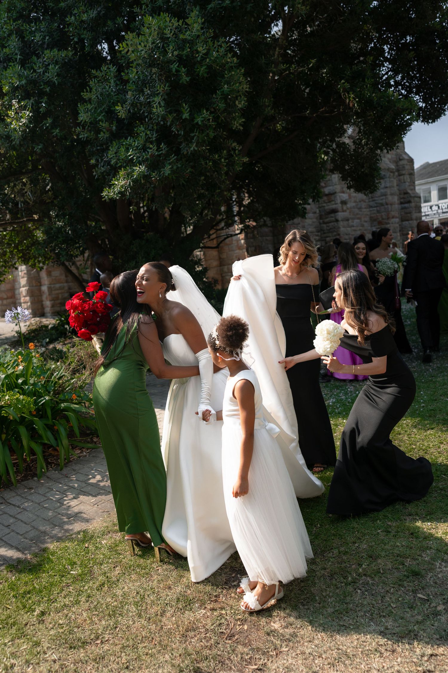 A series of candid moments showing people in white dresses and green attire posing outdoors during a photo session.