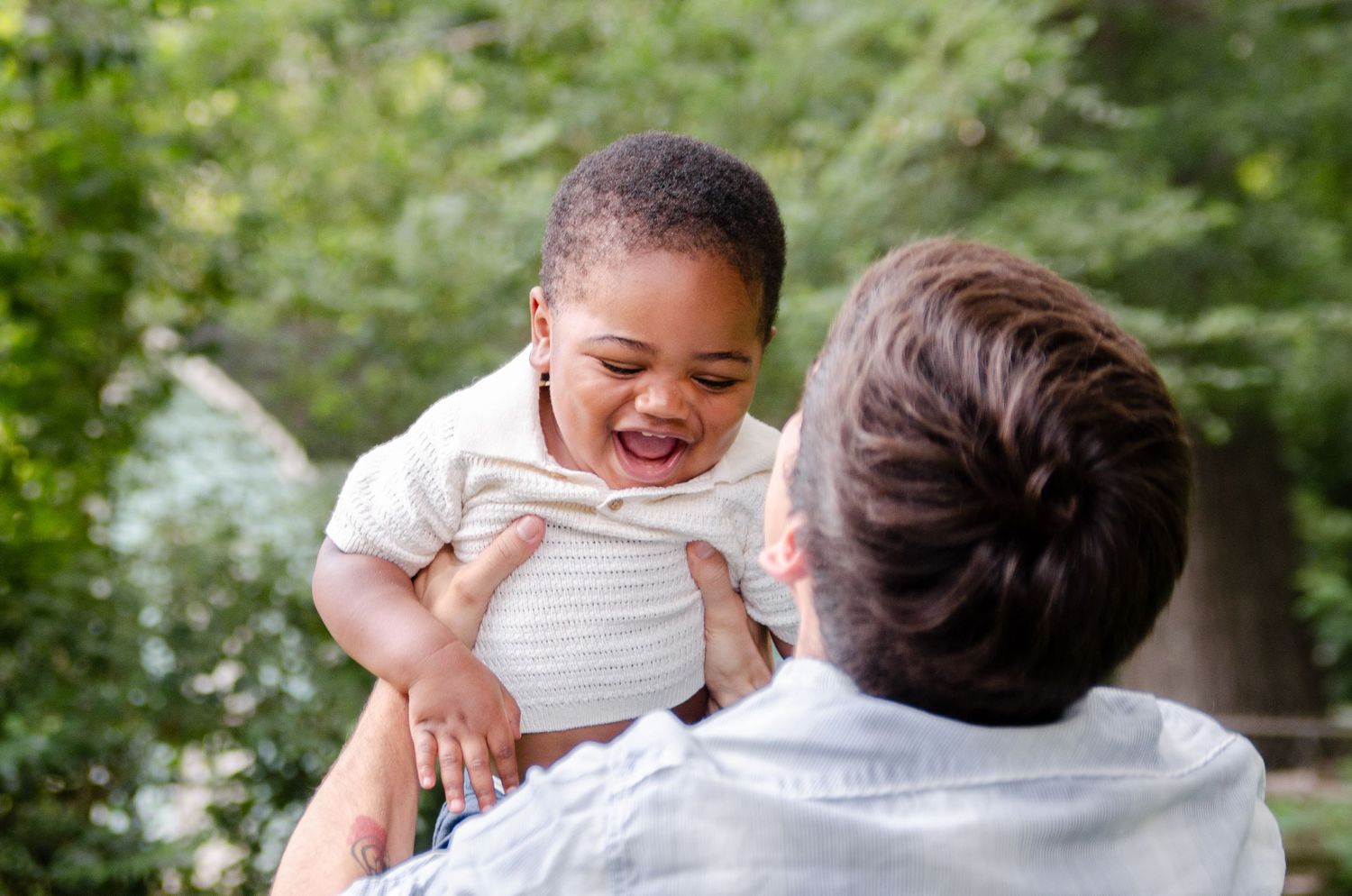 Candid family playtime during an outdoor lifestyle photography session in Charlotte, NC.