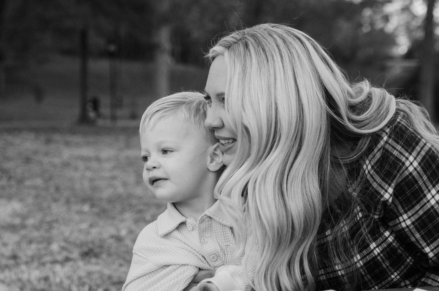Candid outdoor family photography session in Charlotte, NC capturing joyful moments and laughter.