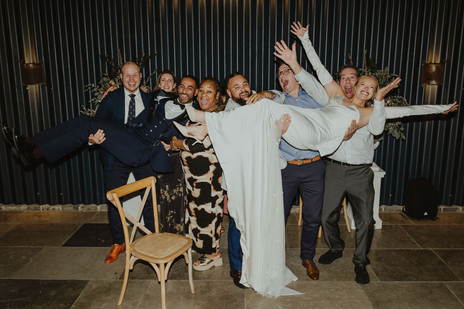 Wedding reception celebration with guests dancing and enjoying the festivities.
