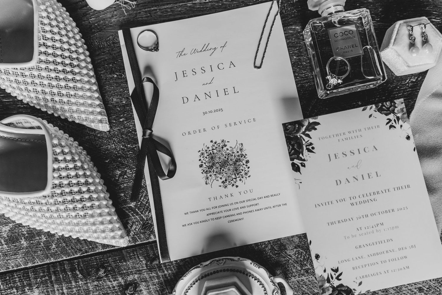Wedding invitation suite in black and white with elegant floral design.