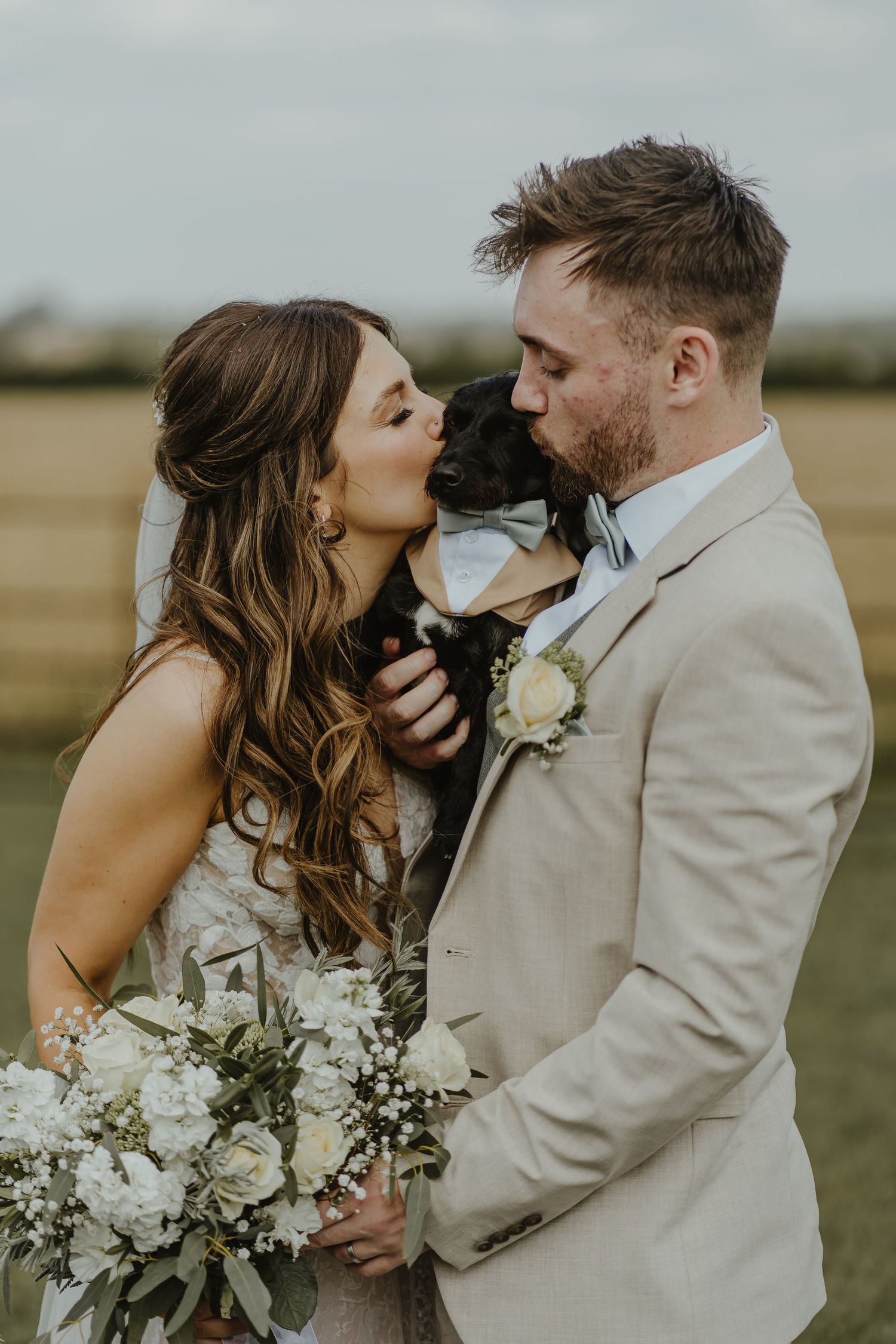 Romantic wedding portraits captured in a serene outdoor setting with natural lighting.