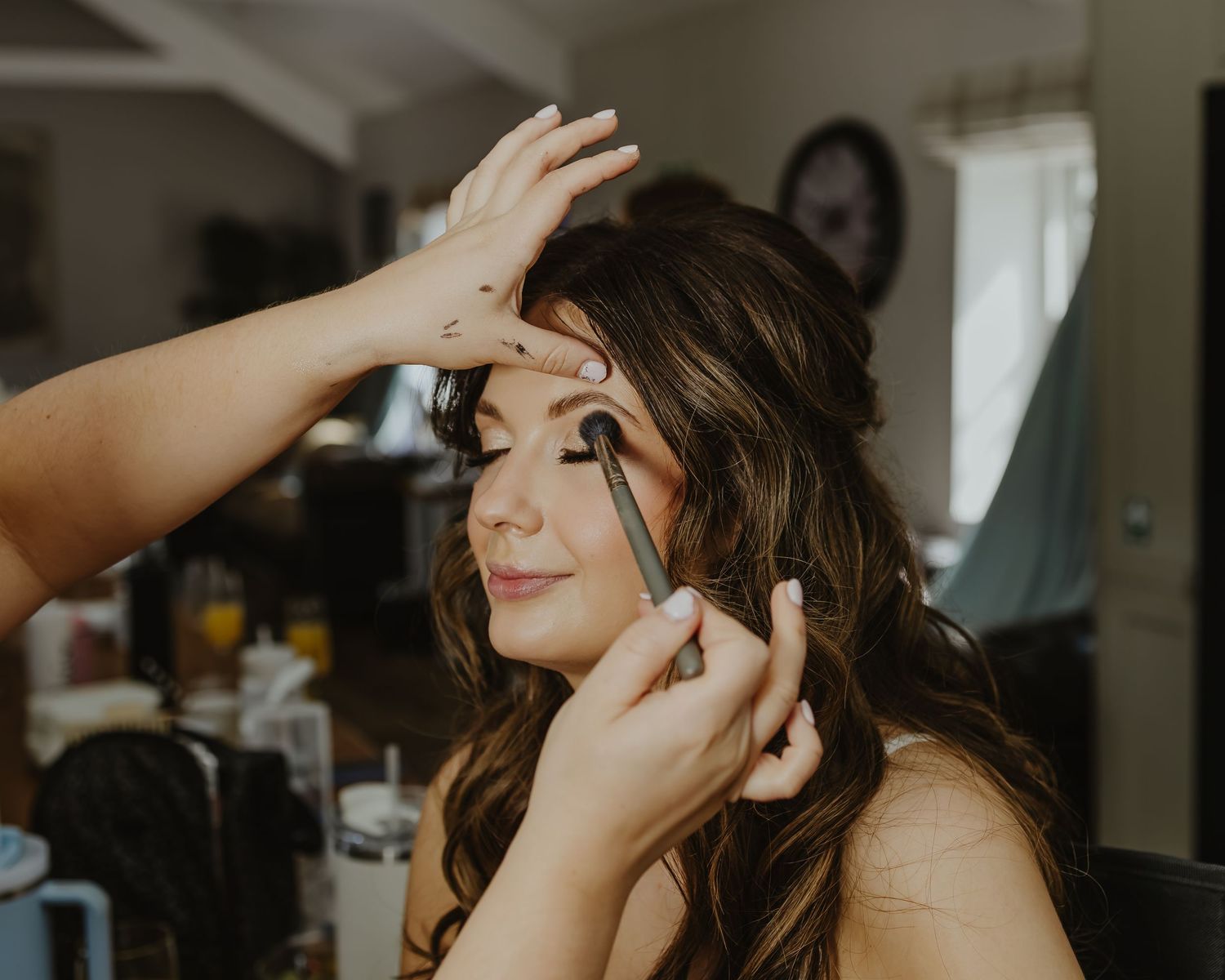 Wedding day preparation moments captured in natural light.
