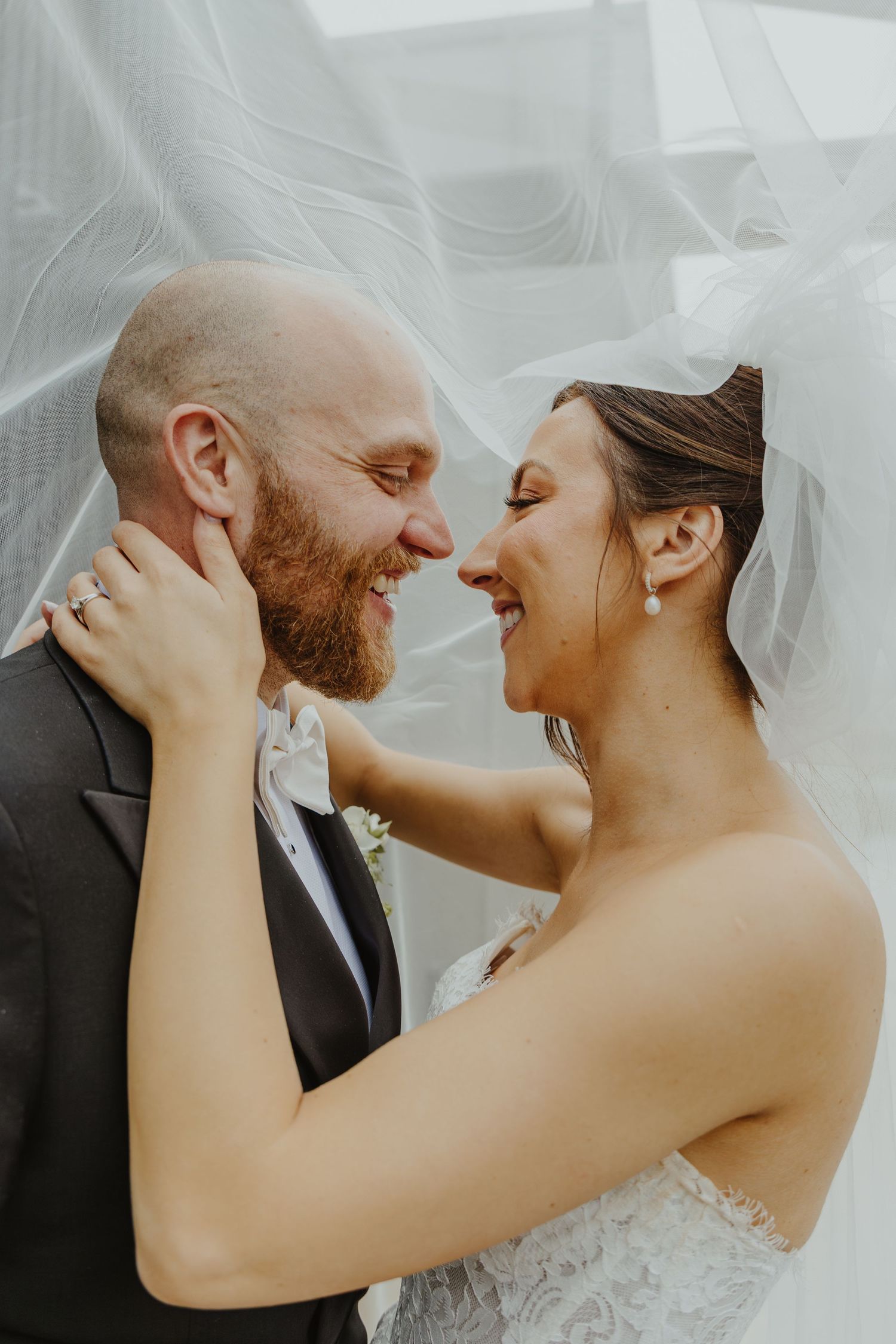A series of intimate wedding photos showing close-up candid moments between a couple sharing joyful laughter.