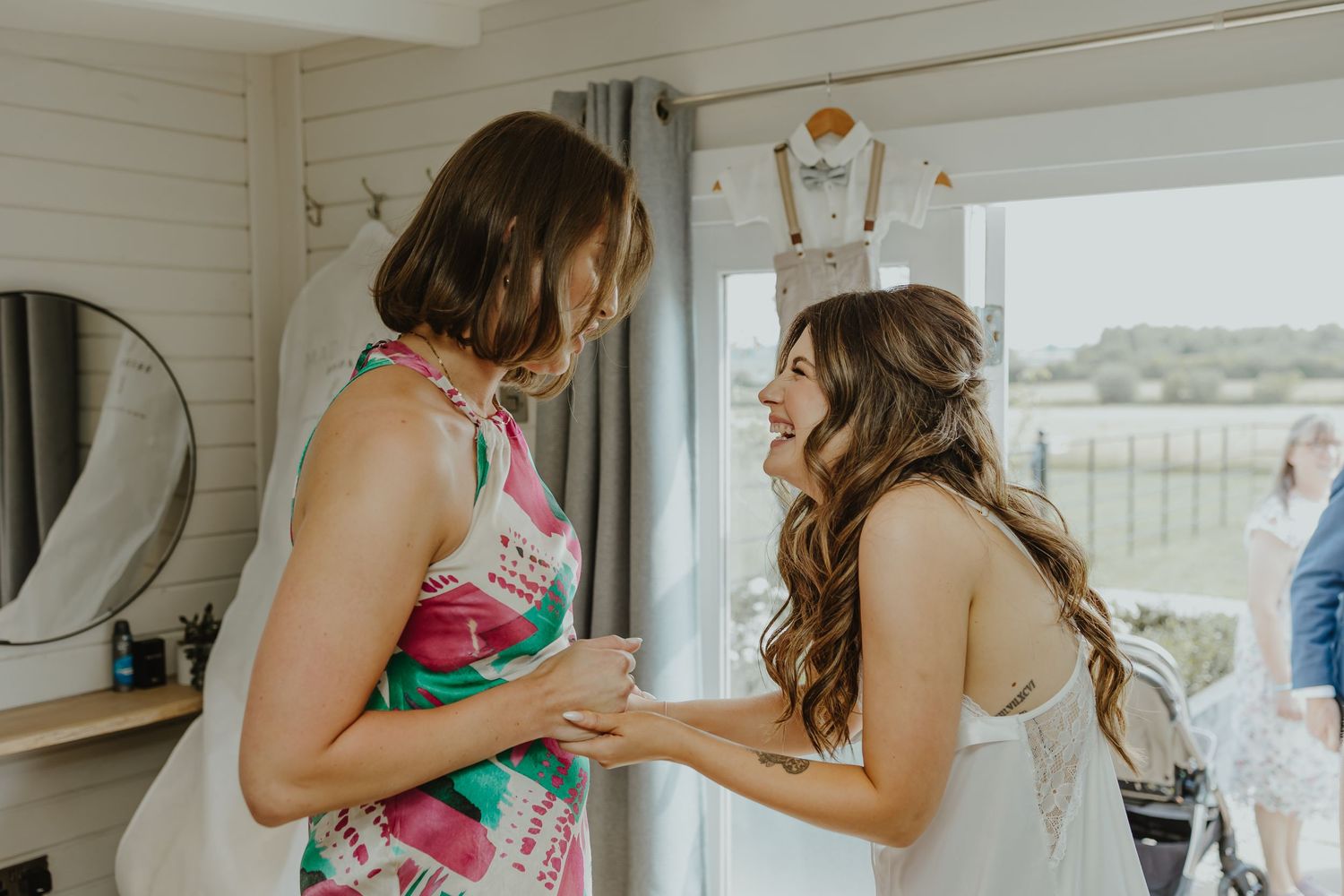 Final touches being made to wedding day preparations in a bright room.