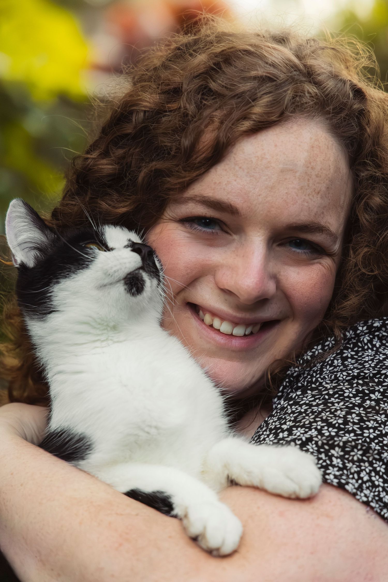 A woman holding a cat