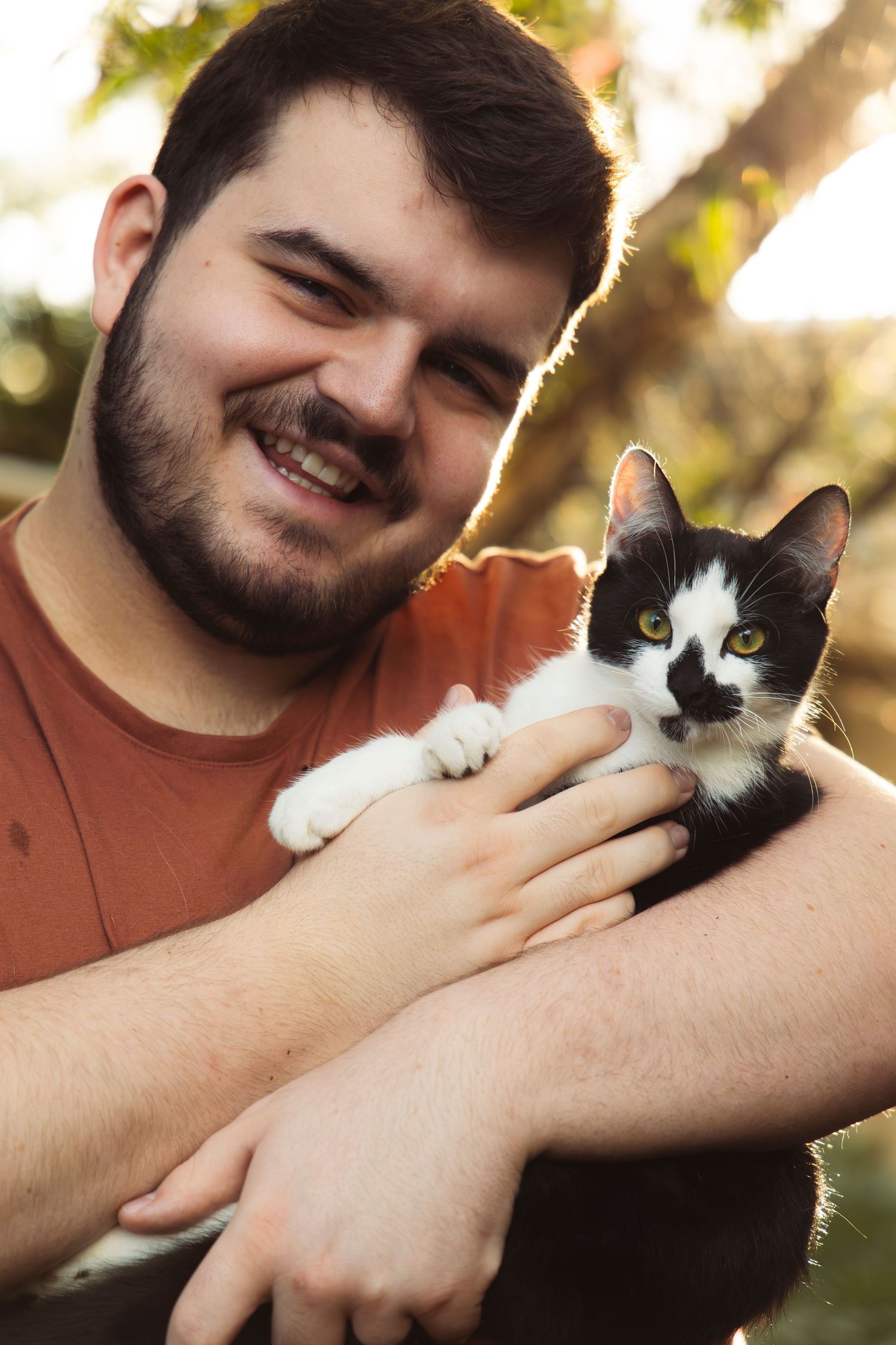 A man holding a cat