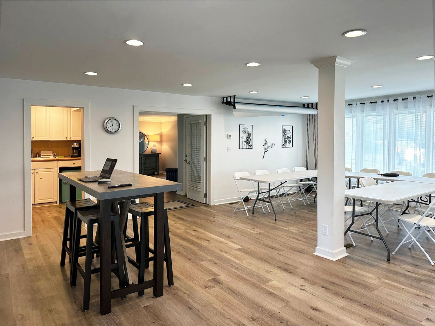 Versatile creative rental studio space with pub table and elegant natural light in Evansville Indiana