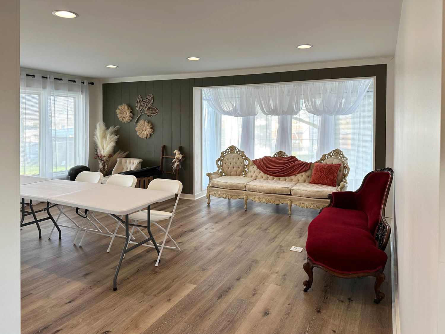 Natural light studio space in Evansville featuring large windows and a minimalist setup for photo shoots
