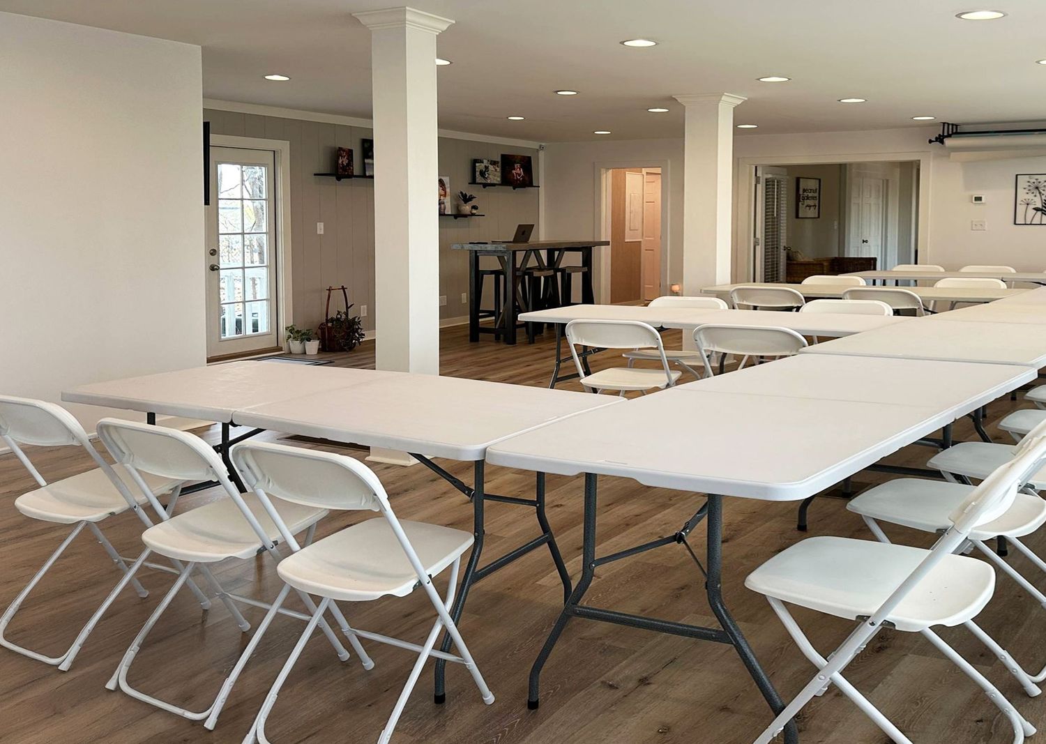 Evansville Photography Studio corporate meeting room configuration with white folding chairs and tables