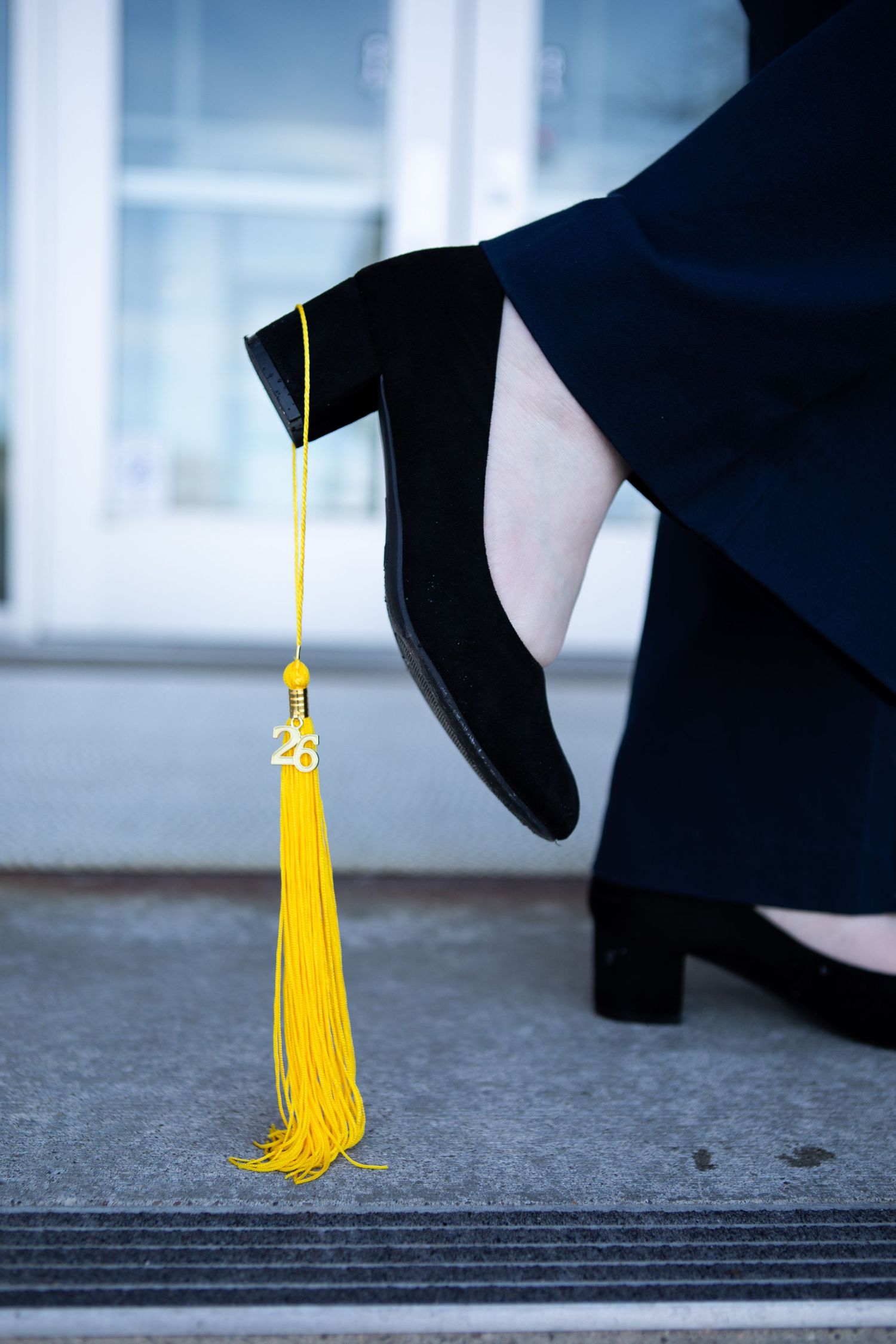 A tassel hangs from the heel of a Montana State University Grad in Bozeman, Montana.