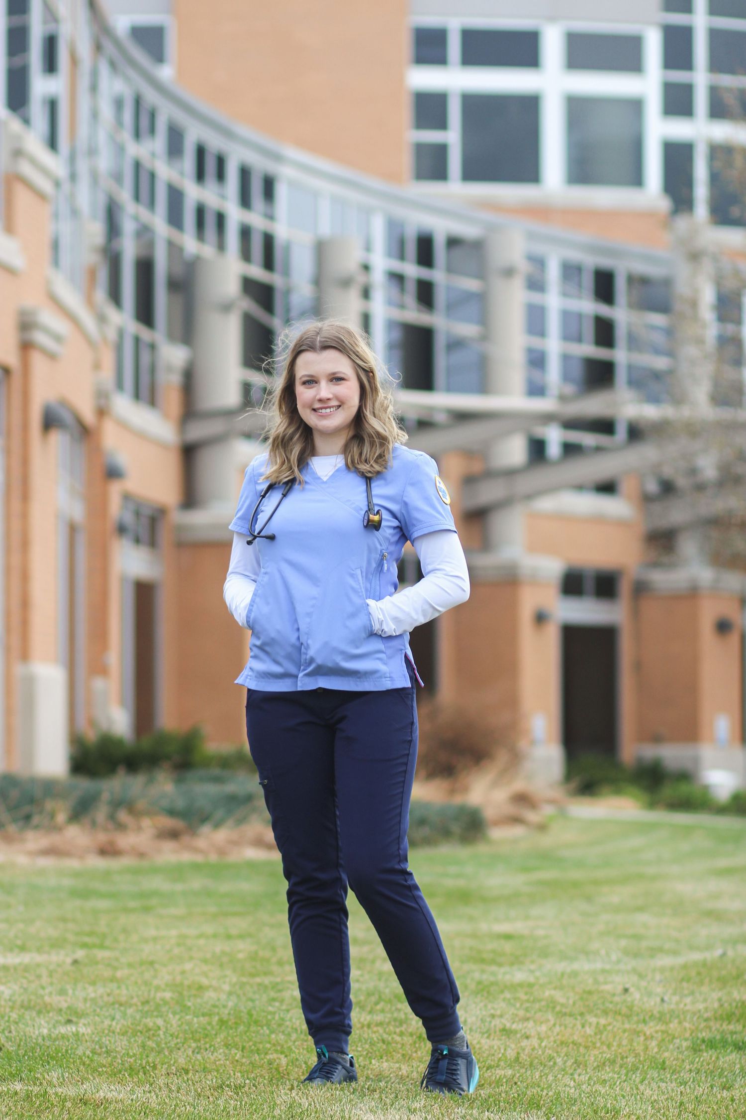 A Montana State nursing grad stands in front of Benfis in Great Falls, Montana.