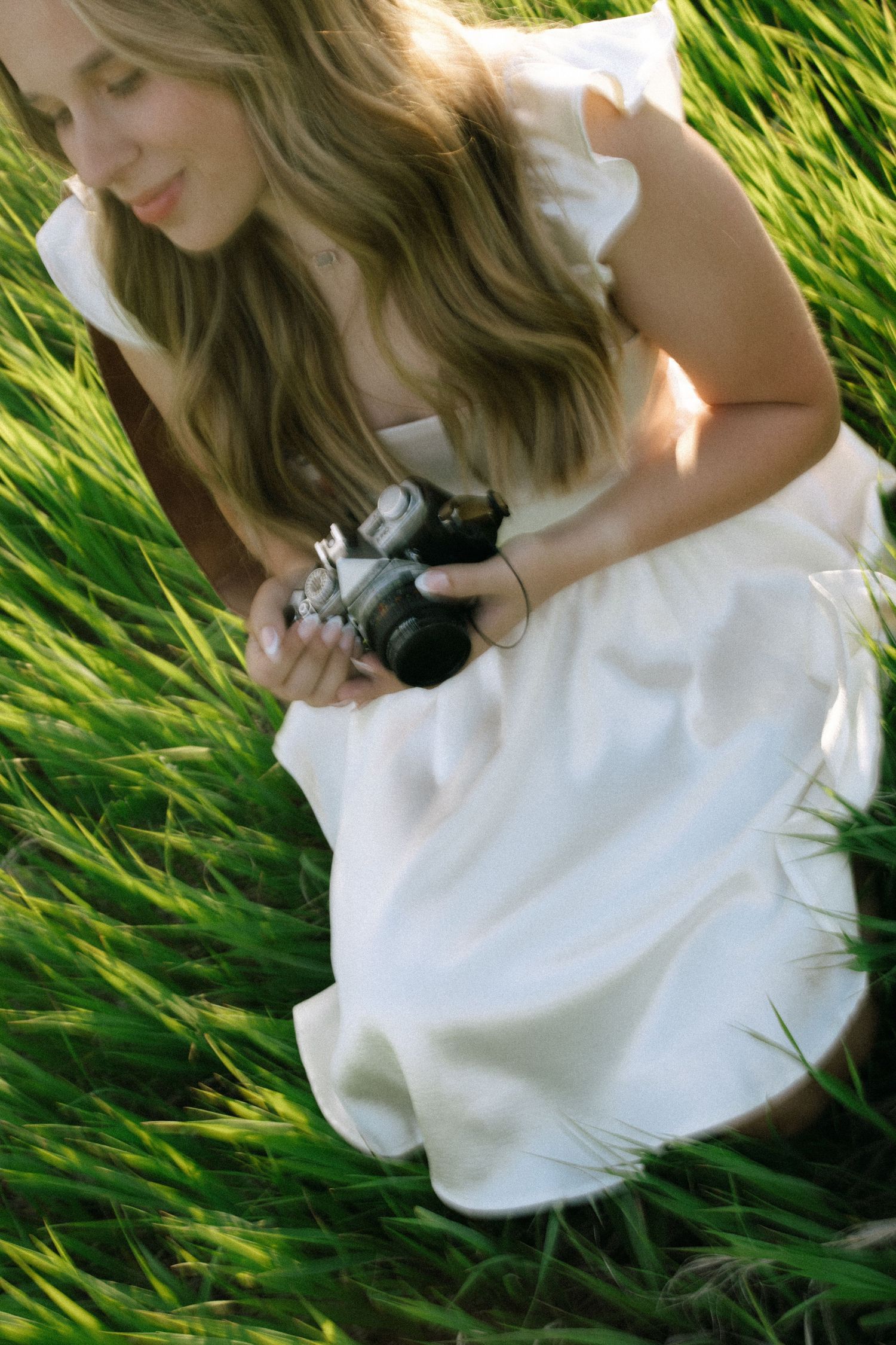 A detail image of Sierrah Elizabeth holding her camera. Image by Mallory Jean Photography