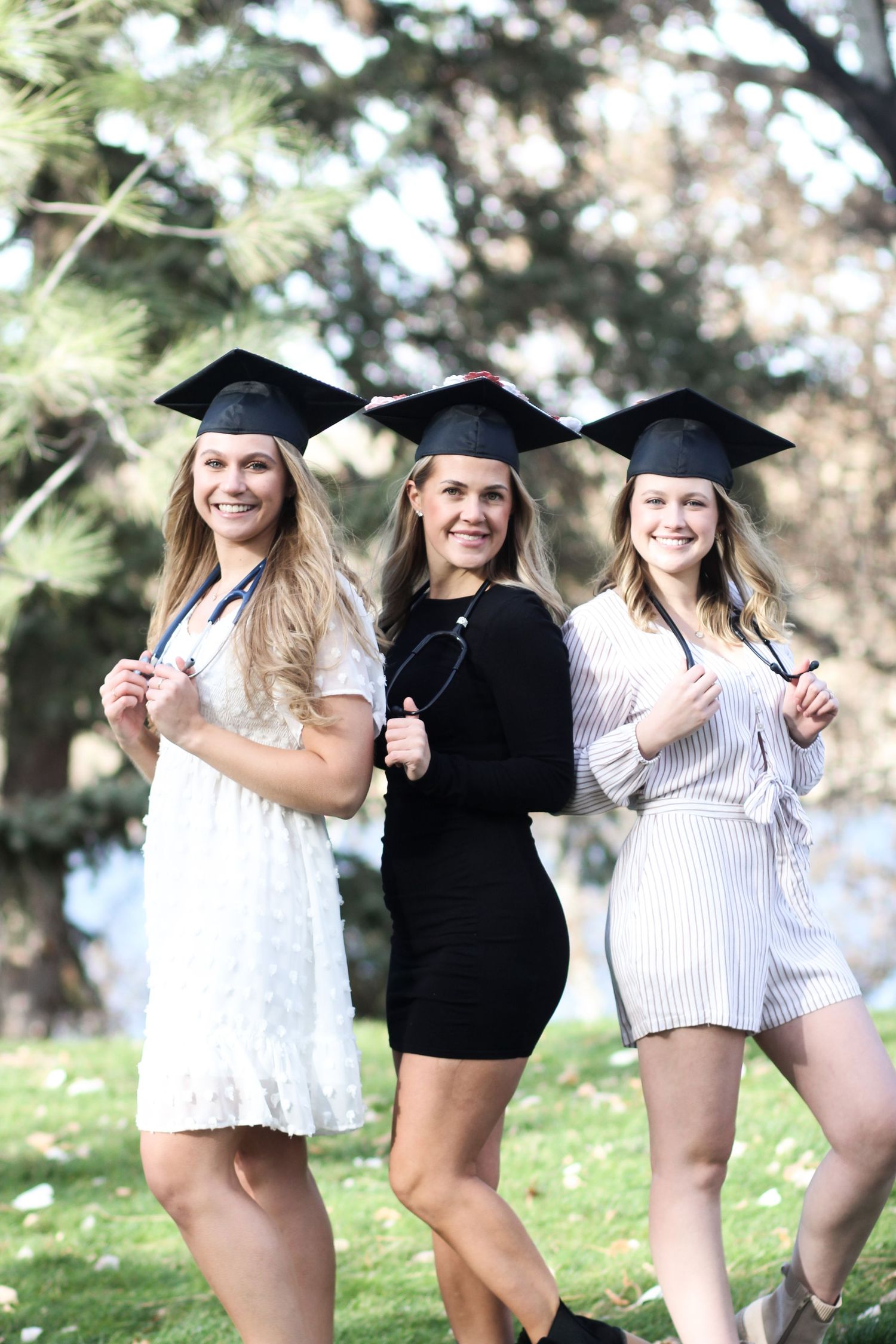 Montana State University Grads posing together in Great Falls.