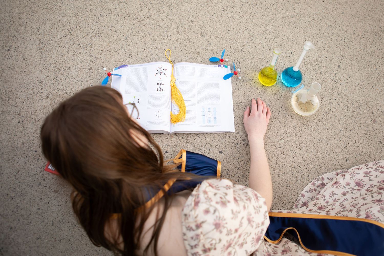 A Montana State University grad reading a chemistry textbook in Bozeman, Montana.