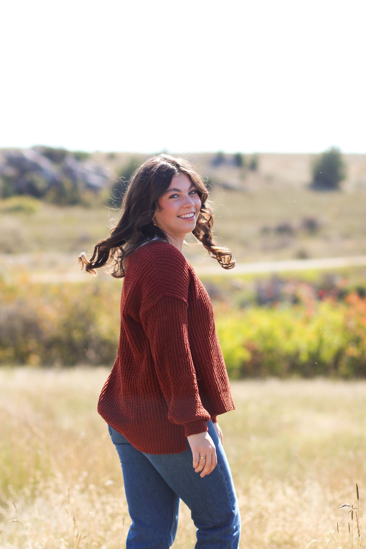A Bozeman Senior spinning in a field in the Gallatin Valley.