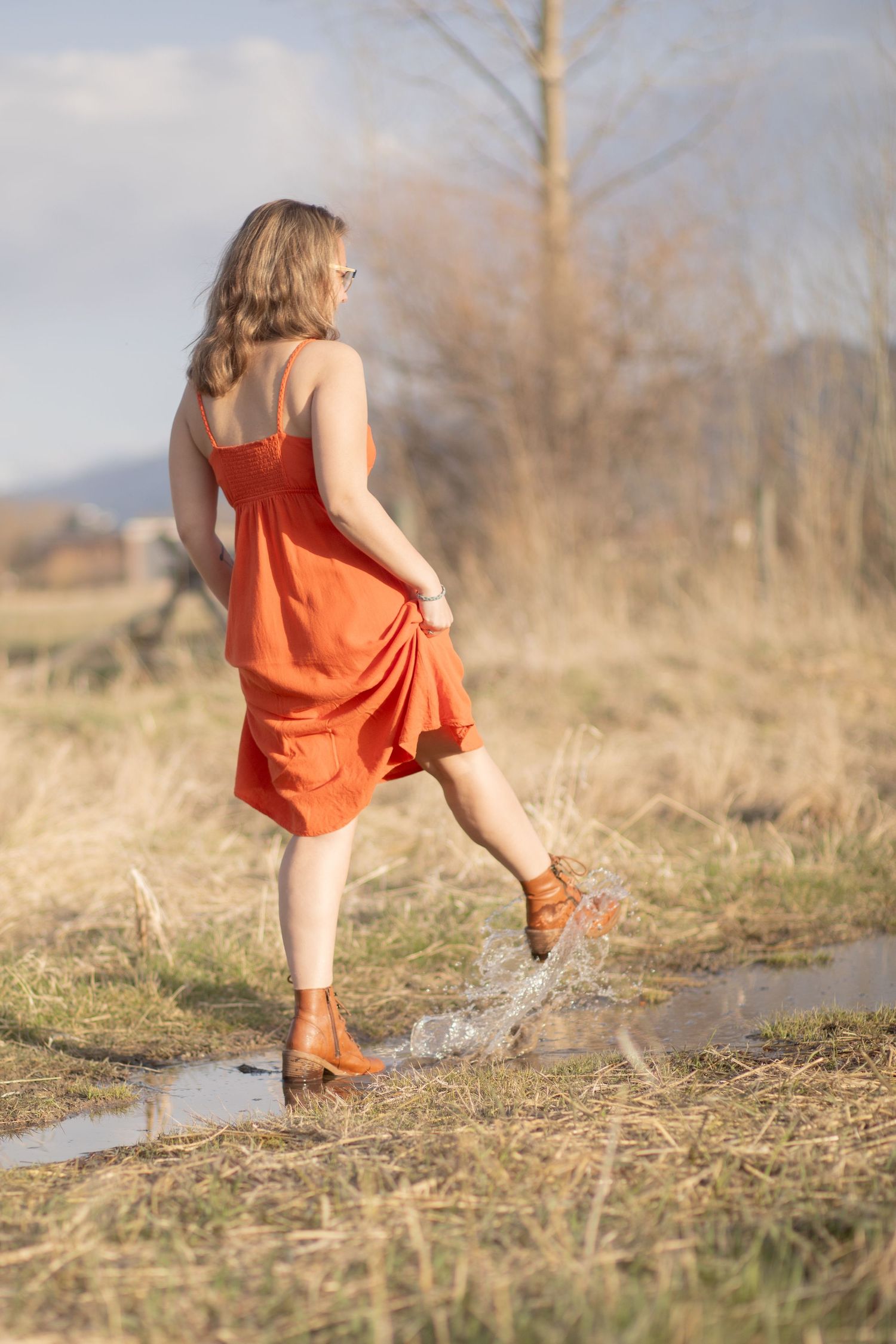 A Bozeman Senior kicks water in a field in Montana.