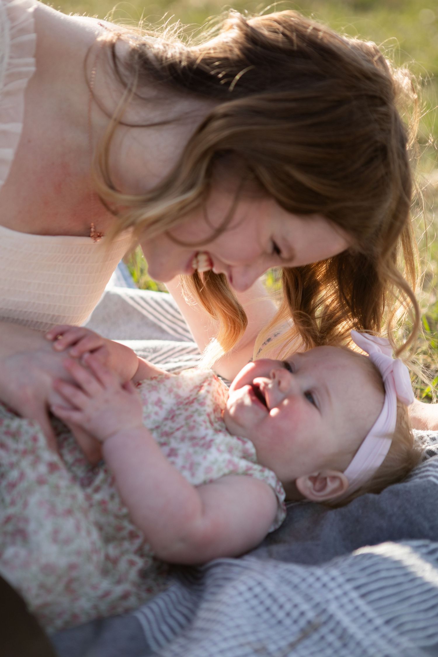A Bozeman mom plays with her baby during a Mother's Day Session in Bozeman, Montana.