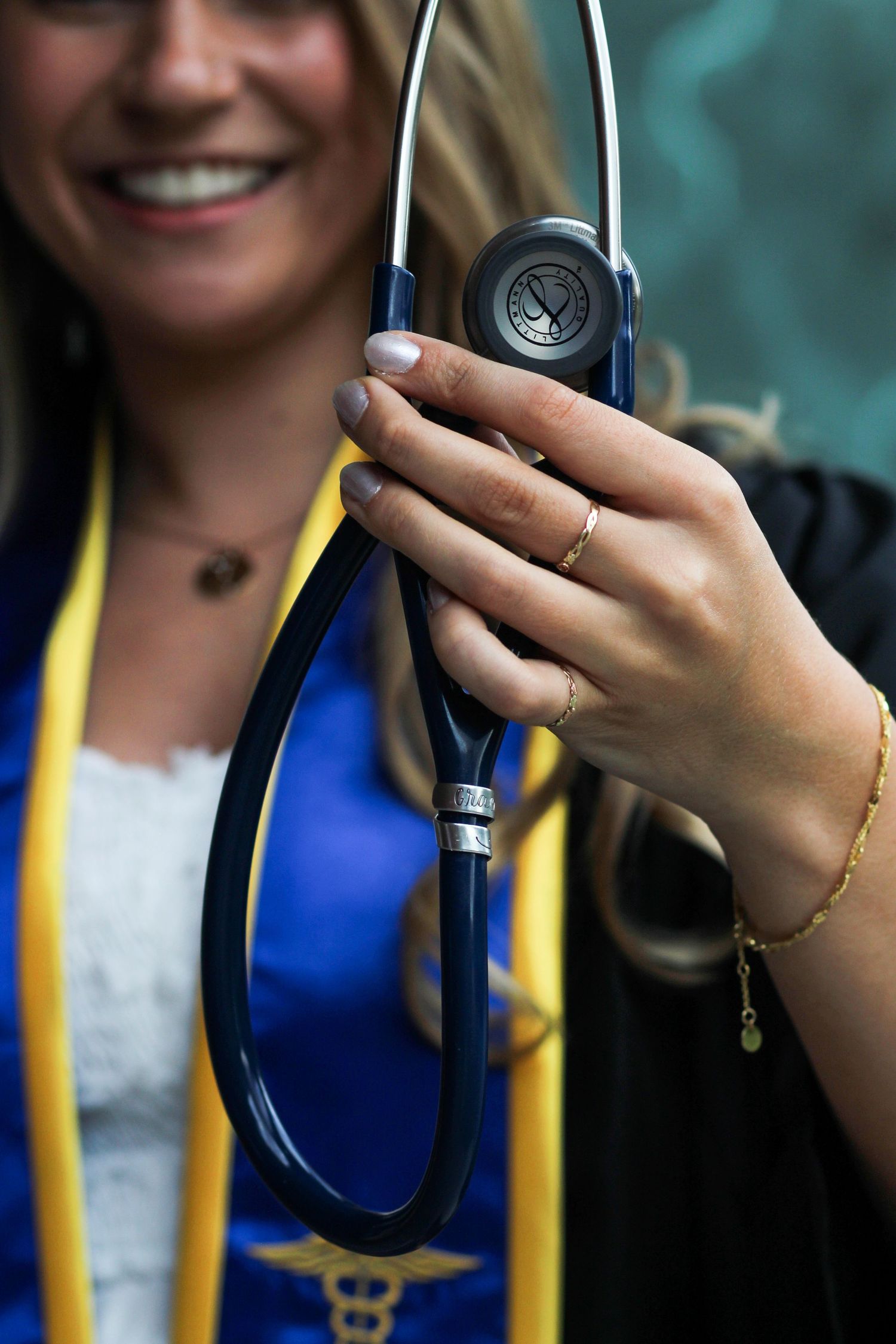 A Montana State Nursing grad shows off her stethoscope.