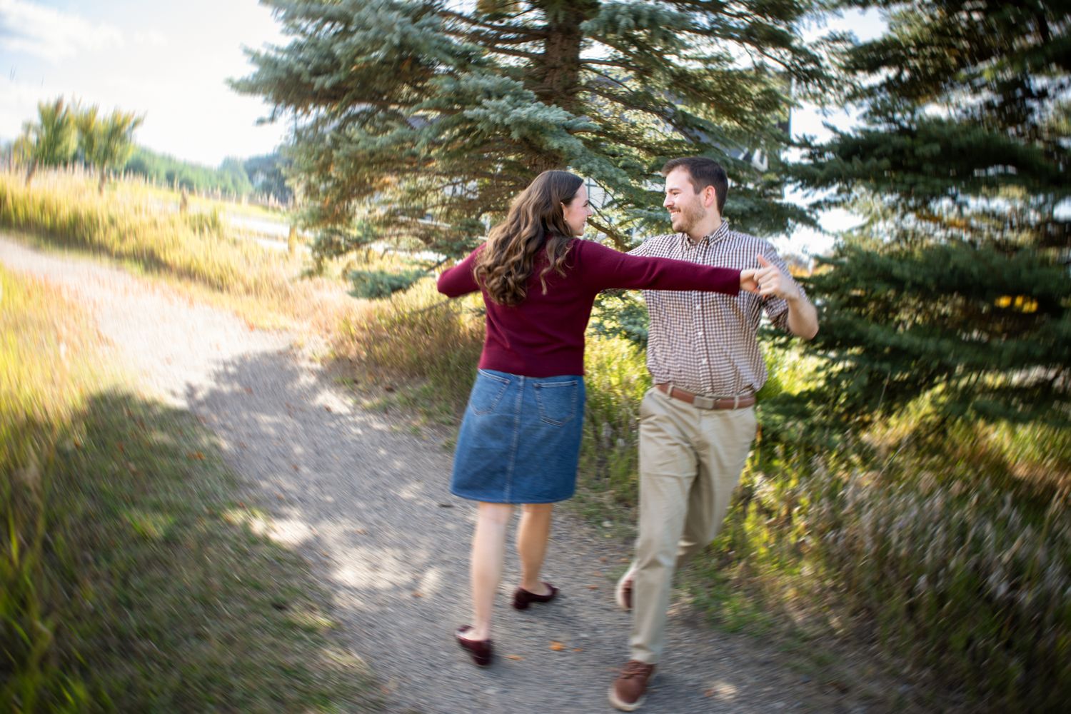 A Montana couple celebrating their engagement by dancing together in Bozeman, Montana.