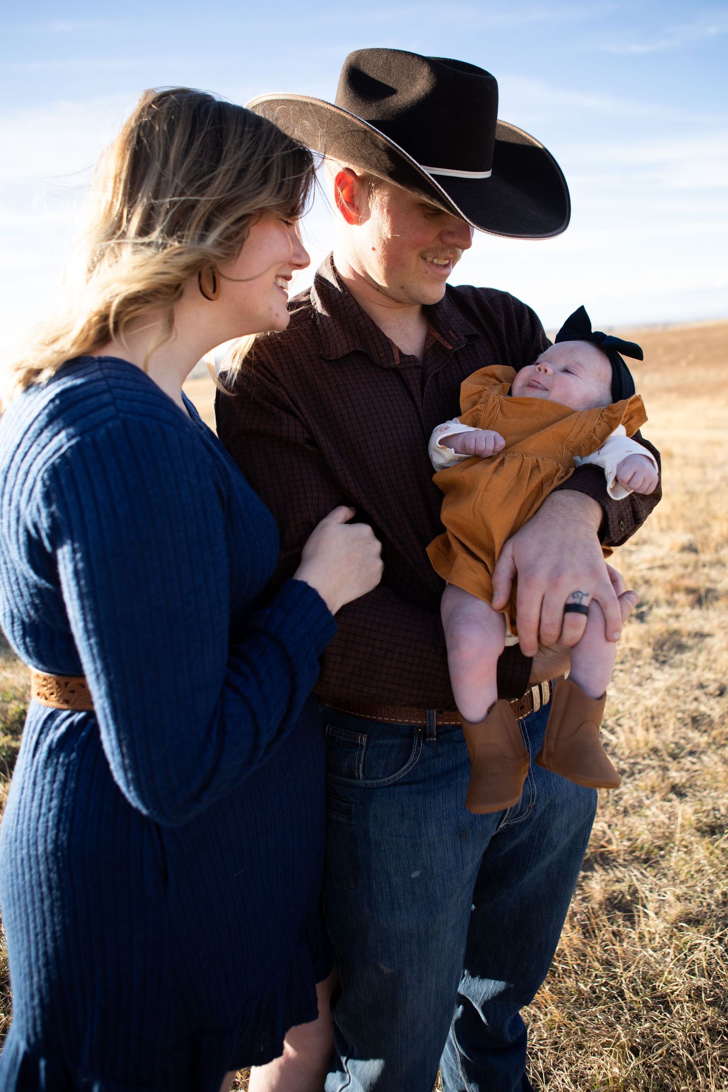 Bozeman Family holding their baby in Bozeman, Montana.