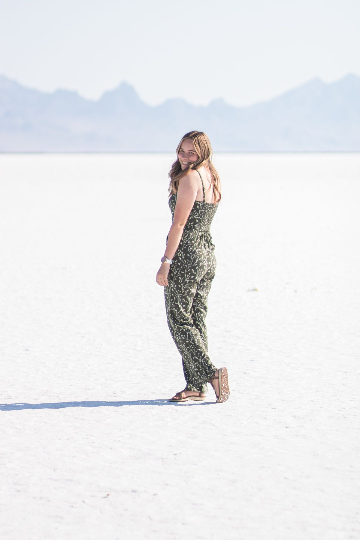 Photographer Sierrah Elizabeth posing on the Bonneville Salt Flats.