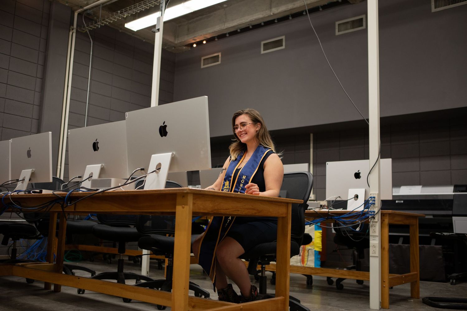 A Montana State University grad sits in the computer lab in Haynes Hall in Bozeman.