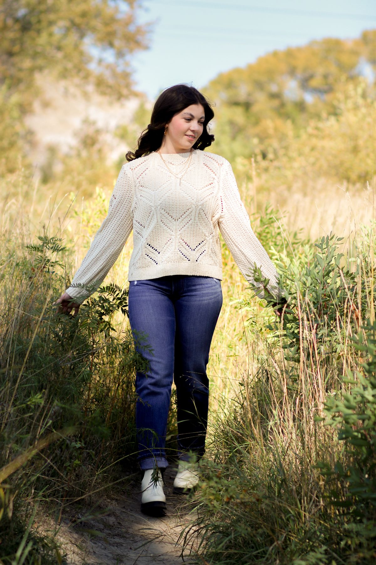 A Bozeman Senior walking down a path in a field in the Gallatin Valley